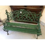 20th cent. Cast iron, two seater garden bench with scrolled arm rests. Five wood slats a/f. 47ins. x
