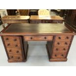 Edwardian mahogany pedestal desk with tooled leather skiver. Central drawer, flanked by false drawer
