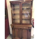 19th cent. Mahogany bookcase cupboard, single drawer over a twin door cupboard, mounted with a