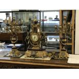 Clocks: 20th cent. Garniture, gilt metal with enamel embellishments and a German movement with