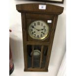 Clocks: 20th cent. Wall clock, oak cased. 10½ins. x 24ins. x 6ins.
