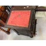 19th cent. Rosewood Davenport, sliding top, concealed writing box. 21ins. x 31ins. x 23ins.