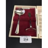 Hallmarked Silver: Christening set comprises a feeding spoon and shover. Birmingham. Angora Co
