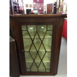 19th cent. Mahogany glazed corner cupboard, three shaped shelves.