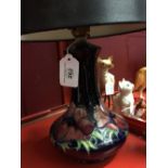 20th cent. Ceramics: Moorcroft table lamp anemones pattern with blue shade.