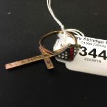Hallmarked Gold: 9ct. Crucifix 1gms and a 9ct. ring with red & white paste stones, 1½gms.