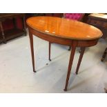 19th cent. Fruitwood banded oval occasional table. The rim and delicate tapering supports inlaid.