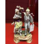 19th cent. Vienna figure of a male holding grapes, with a female holding a flower. No. 1368. 5½ins.