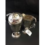 Hallmarked Silver: Cream jug and sugar bowl with cover. Birmingham. Adie Brothers.