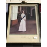 Royal Autographs: Two colour photographs of Her Majesty Queen Elizabeth II, one signed and dated