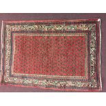 Rugs: Red ground Iranian rug, stylised birds & flowers, guard borders. 60ins. x 42ins.