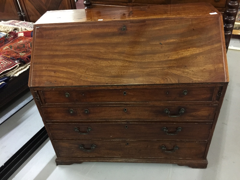 Early 19th cent. Mahogany bureau, fitted interior, cock beaded drawers and low swept bracket