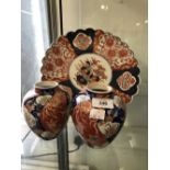 Early 20th cent. Japanese Imari scallop rimmed dish and a pair of small vases.