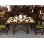 20th cent. Oak draw leaf table. Barley twist supports and stretchers. With six dining chairs.