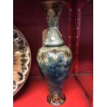 Royal Doulton: Stoneware vase, tube lined, decoration mottled blue, green and grey. Signed LB. No.