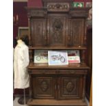 Early 20th cent. Oak continental heavily carved dresser. The base having two drawers over a two door