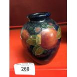 Moorcroft: Pomegranate, small baluster vase, signed to base. 4ins.