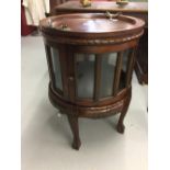 20th cent. Mahogany circular reproduction drinks cabinet with serving tray.