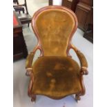 19th cent. Walnut frame, library button back chair, serpentine front & supports rising off ceramic