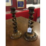 19th cent. Walnut candlesticks with twin barley twist columns. A pair. 10ins.