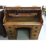 Edwardian oak tambour fronted desk. Fitted interior, twin pedestals, 4 drawers to the left, 2