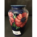 Moorcroft - The Newman Collection: c1950 Small baluster vase, anemone on blue ground, with paper