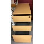 20th cent. Beech effect filing cabinet. Three drawers with key. 15½ins. x 28ins. x 31½ins.