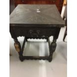 19th cent. Ebonised games table, envelope folding carved top, carved frieze and turned supports.