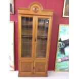20th cent. Oak dome topped, lead glazed bookcase with twin solid doors below. 34ins. x 80ins. x