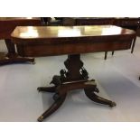 19th cent. Flame mahogany fold-over swivel card table on four supports.