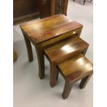 20th cent. Mango wood nest of three tables with curved legs.