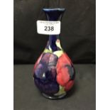 Moorcroft - The Newman Collection: c1925 Slender necked posy vase in the blue ground pansy