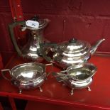 20th cent. Plated Ware: Tea set comprised of hot water pot, teapot, sugar bowl, and a milk jug (4).