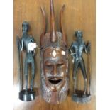 Tribal African hardwood, carved figures. Senegal of bearded male hunters plus a carved mask. (3)