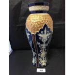 20th cent. Royal Doulton blue ground, baluster vase, gilt turning to the shoulders. 11ins.