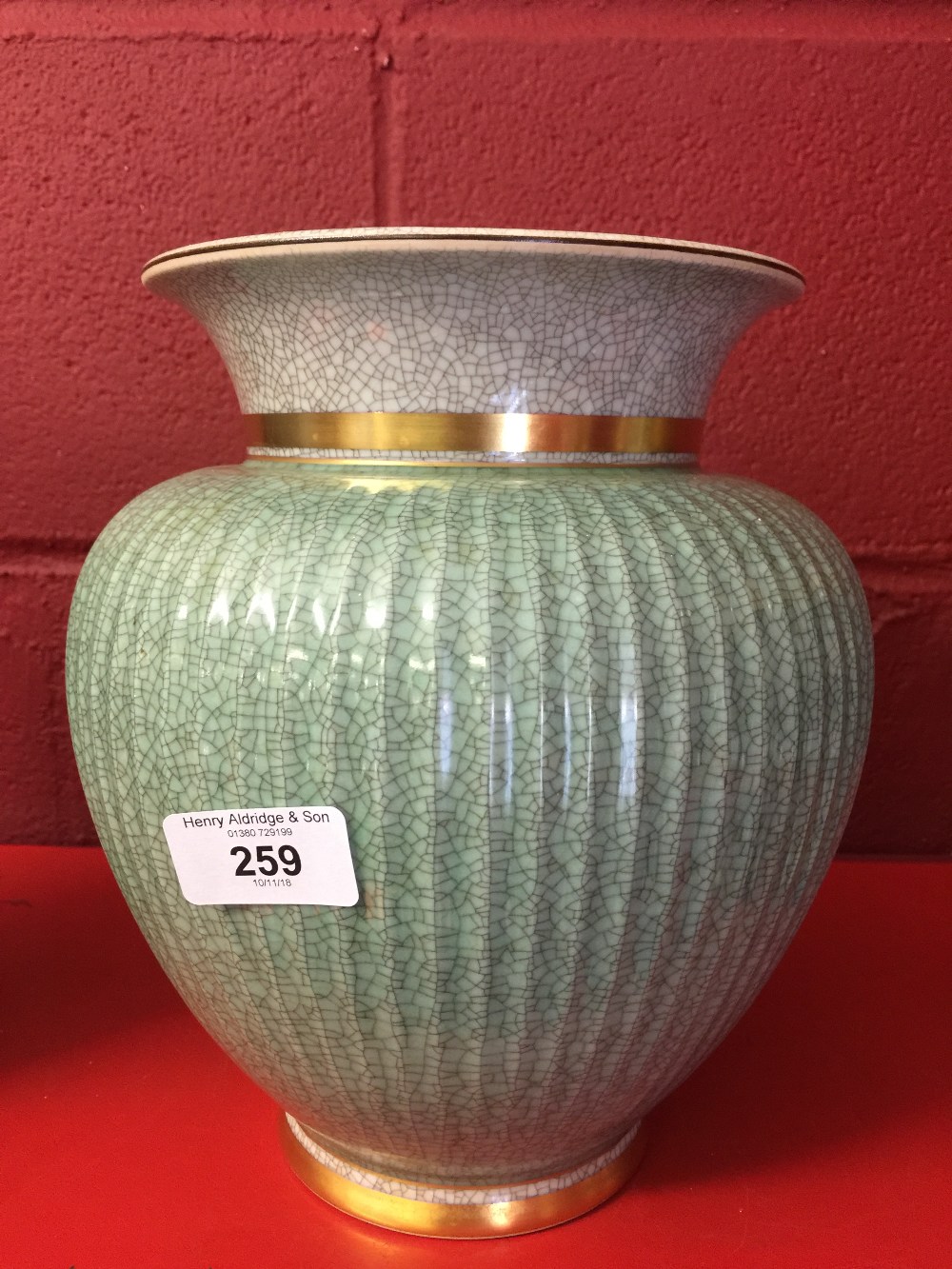 20th cent. Ceramics: Royal Copenhagen Celadon vase, crackle glaze, baluster shape. Fluted design,