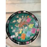 20th cent. Ceramics: Oriental charger with exotic birds and flowers. Diameter 14½ins.