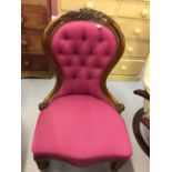 19th cent. Mahogany button back nursing chair, serpentine front on turned supports 36ins. x 30ins. x