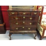 18th cent. Mahogany and oak chest on stand, 3 over 3 graduated drawers, branded inlay and brass