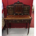 19th cent. Mahogany desk drop down slope opening to reveal a stationary cupboard flanked by banks of