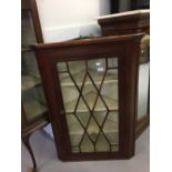 19th cent. Mahogany glazed corner cupboard, three serpentine shelves.