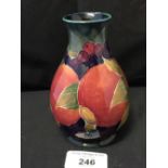 Moorcroft - The Newman Collection: c1918 Small baluster vase, pomegranate pattern on pale green