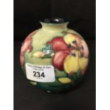 Moorcroft - The Newman Collection: c1950 Small globular vase, African Lily pattern on green