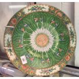 20th cent. Chinese: Cantonese charger decorated in famille rose and verte colour way. 13ins diam.