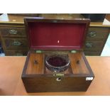 19th cent. Mahogany tea box in sarcophagus form with two covered tea compartments and a glass