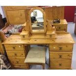 20th cent. Pine twin pedestal dressing table, six drawers and a dressing mirror. Two bedside