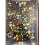 Games and Pastimes: A large selection of Victorian and later glass marbles. (1 tray)