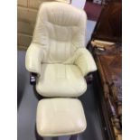 20th cent. Cream leather 'Stressless style' reclining chair with matching footstool. (2)