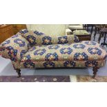 Edwardian upholstered chaise longue. Turned supports on ceramic castors. 70ins. x 30ins. x 30ins.