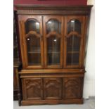 20th cent. Beech glazed bookcase 2 shelves. The cupboards beneath has two doors and one shelf 79ins.